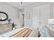Serene bedroom with soft bedding, wood dresser, and closet doors with a calming aesthetic at 3543 Cedarvale Ct, Powder Springs, GA 30127