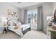 Cozy bedroom with a large window, neutral carpet, and stylish decor that provides great comfort at 3543 Cedarvale Ct, Powder Springs, GA 30127