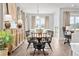 Bright and inviting dining room with a wooden table and chairs, perfect for Gathering meals at 3543 Cedarvale Ct, Powder Springs, GA 30127