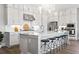 Bright kitchen with modern white cabinets, stainless steel appliances, and a large island with seating at 3543 Cedarvale Ct, Powder Springs, GA 30127