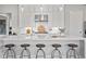 Modern kitchen with sleek white cabinets, stainless steel appliances, and a large island at 3543 Cedarvale Ct, Powder Springs, GA 30127