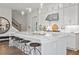 Stylish kitchen featuring a large island, white cabinets, and modern stainless steel appliances at 3543 Cedarvale Ct, Powder Springs, GA 30127
