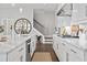 Well-lit kitchen with sleek white cabinets, stainless steel appliances, and stylish countertops at 3543 Cedarvale Ct, Powder Springs, GA 30127