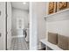 Well-organized laundry room featuring modern washer, dryer, and built-in shelving at 3543 Cedarvale Ct, Powder Springs, GA 30127