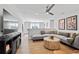 Stylish living room with modern decor, cozy seating, and a large TV, perfect for relaxation and entertainment at 3543 Cedarvale Ct, Powder Springs, GA 30127