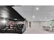 Spacious finished basement with theater seating, a projector screen, and recreation area with ping pong table at 1400 Squire Ln, Cumming, GA 30041
