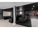 Finished basement with home theater seating and large screen at 1400 Squire Ln, Cumming, GA 30041
