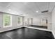 Unfurnished basement with windows for natural light and a mirror along the wall at 1400 Squire Ln, Cumming, GA 30041