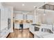 Spacious kitchen with stainless appliances, quartz countertops, and hardwood floors at 1400 Squire Ln, Cumming, GA 30041