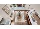 Overhead view of the living room featuring a fireplace, a dining area, and a breakfast bar at 1400 Squire Ln, Cumming, GA 30041