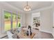 Bright home office with neutral tones, large windows, and backyard view at 1400 Squire Ln, Cumming, GA 30041