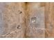 A close up of the shower with tile walls and design at 1400 Squire Ln, Cumming, GA 30041