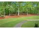 Expansive lawn area with mature trees providing shade at 1400 Squire Ln, Cumming, GA 30041