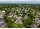 Neighborhood view featuring mature trees, well-maintained homes, and lush greenery at 2049 Kinderton Manor Dr, Johns Creek, GA 30097