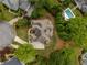 Expansive home featuring a large lot, backyard pool, patio, and lush landscaping at 2049 Kinderton Manor Dr, Johns Creek, GA 30097