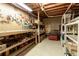 Unfinished basement workshop area with pegboard and shelving at 2049 Kinderton Manor Dr, Johns Creek, GA 30097