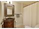 Bathroom with decorative mirror, vanity, and shower at 2049 Kinderton Manor Dr, Johns Creek, GA 30097