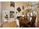 Spacious dining area with a fireplace, chandelier, and built-in shelves and views to the other living areas at 2049 Kinderton Manor Dr, Johns Creek, GA 30097