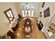Elegant dining room with hardwood floors and chandelier viewed from above at 2049 Kinderton Manor Dr, Johns Creek, GA 30097