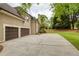 Charming home with a two-car garage and well-maintained landscaping, creating excellent curb appeal at 2049 Kinderton Manor Dr, Johns Creek, GA 30097