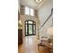 Elegant foyer with hardwood floors, staircase, and view of the front yard at 2049 Kinderton Manor Dr, Johns Creek, GA 30097