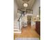 Bright foyer with hardwood floors, high ceilings, and elegant staircase at 2049 Kinderton Manor Dr, Johns Creek, GA 30097