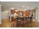 Spacious kitchen with a center island and bar stools, perfect for entertaining guests and Gathering at 2049 Kinderton Manor Dr, Johns Creek, GA 30097