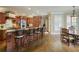 Gourmet kitchen featuring a large island with bar seating, granite countertops, and stainless steel appliances at 2049 Kinderton Manor Dr, Johns Creek, GA 30097