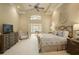 Spacious main bedroom boasts vaulted ceilings, ceiling fan and access to study at 2049 Kinderton Manor Dr, Johns Creek, GA 30097