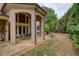 Covered patio with dining set and ceiling fan, perfect for outdoor living at 2049 Kinderton Manor Dr, Johns Creek, GA 30097