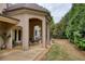Covered patio with outdoor dining and seating area overlooking the lawn at 2049 Kinderton Manor Dr, Johns Creek, GA 30097