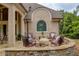Inviting stone patio with comfortable seating, perfect for outdoor relaxation and entertaining at 2049 Kinderton Manor Dr, Johns Creek, GA 30097