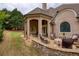 Inviting stone patio with comfortable seating, perfect for outdoor relaxation and entertaining at 2049 Kinderton Manor Dr, Johns Creek, GA 30097