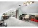 Spacious attic room with multiple desks and bright light at 2700 Sandstone Dr, Lawrenceville, GA 30043
