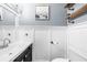 Well-lit bathroom with a modern vanity, stylish fixtures, and board and batten wall paneling at 2700 Sandstone Dr, Lawrenceville, GA 30043