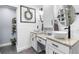 Bright bathroom featuring dual vessel sinks, granite countertops, and stylish shiplap walls at 2700 Sandstone Dr, Lawrenceville, GA 30043