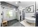 Modern bathroom featuring a glass-enclosed shower, dual vessel sinks, and stylish fixtures at 2700 Sandstone Dr, Lawrenceville, GA 30043