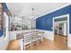 Bright dining room featuring hardwood floors, built-in shelving, and views of the kitchen at 2700 Sandstone Dr, Lawrenceville, GA 30043