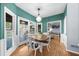 Bright dining room featuring a table with seating and French doors to the outside deck at 2700 Sandstone Dr, Lawrenceville, GA 30043