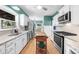 Kitchen features stainless steel appliances, granite counters and a wooden island at 2700 Sandstone Dr, Lawrenceville, GA 30043