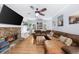 Living room features a stone fireplace, and a leather sectional at 2700 Sandstone Dr, Lawrenceville, GA 30043