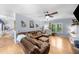 Bright living room featuring large windows, hardwood floors, and a comfortable leather sectional at 2700 Sandstone Dr, Lawrenceville, GA 30043