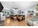 Spacious living room with a large leather sectional, built-in shelving, and natural light at 2700 Sandstone Dr, Lawrenceville, GA 30043