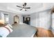 Comfortable bedroom features hardwood floors, tray ceiling and ample natural light at 2700 Sandstone Dr, Lawrenceville, GA 30043