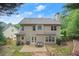 Exterior of home with a patio, grill and dining set perfect for outdoor entertaining at 2995 Boulder Walk Se Ct, Atlanta, GA 30316