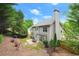 Backyard featuring trees, patio, grass and a home at 2995 Boulder Walk Se Ct, Atlanta, GA 30316