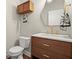 Bathroom featuring a vanity with a sink, a toilet, and a modern mirror at 2995 Boulder Walk Se Ct, Atlanta, GA 30316