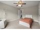 Well-lit bedroom with carpet, ceiling fan, comfortable chair, and a bright atmosphere at 2995 Boulder Walk Se Ct, Atlanta, GA 30316