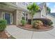 Charming home featuring a stone accent wall and a welcoming blue front door surrounded by lush landscaping at 2995 Boulder Walk Se Ct, Atlanta, GA 30316