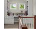 Hallway with integrated bookcase, storage cabinets and writing desk, and two windows with natural light at 2995 Boulder Walk Se Ct, Atlanta, GA 30316